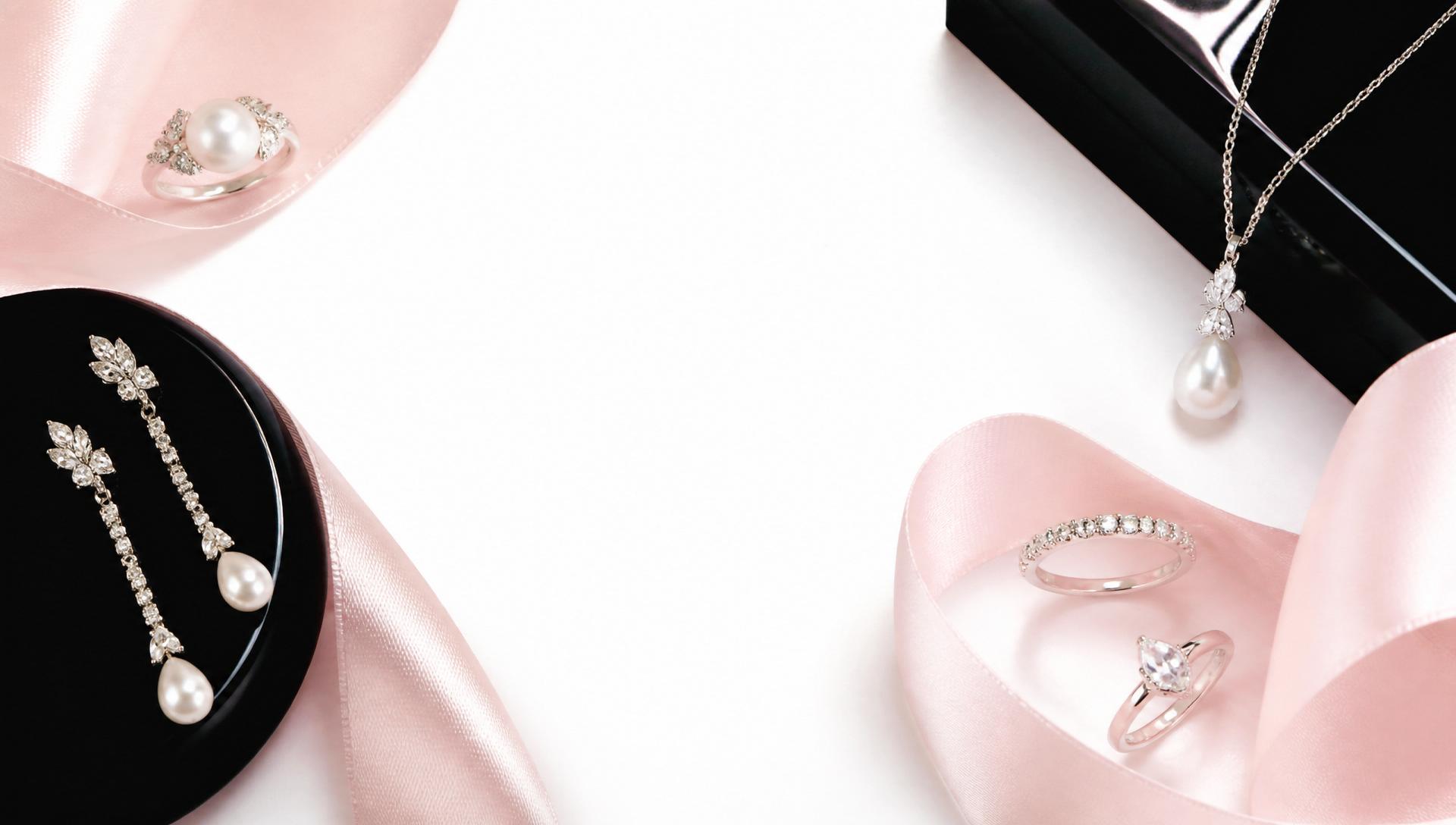 Pearl and diamond jewellery styled with pink silk and black lacquer